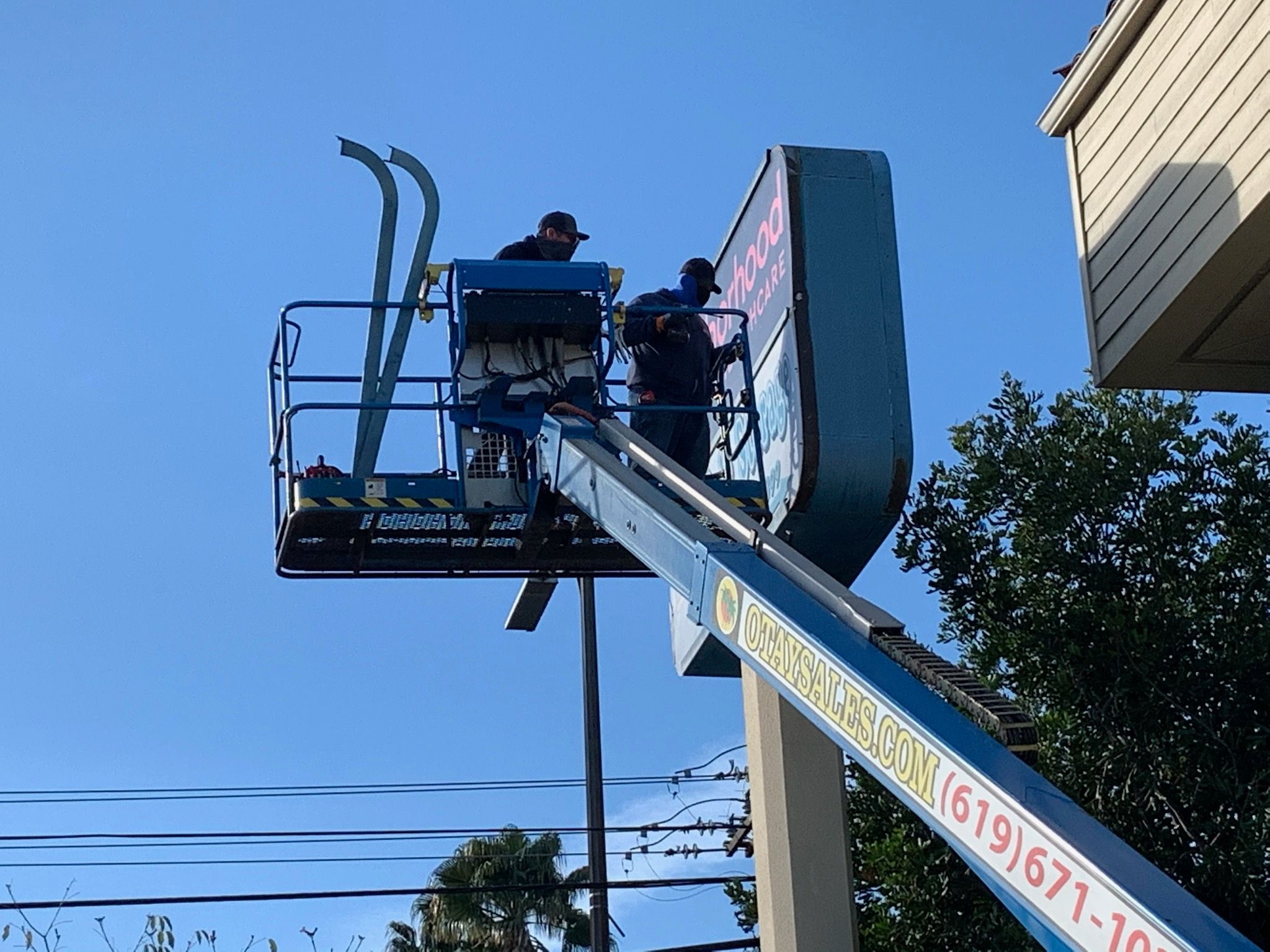 Installing New Lexan Sign Faces to Pylon Signs in Escondido CA